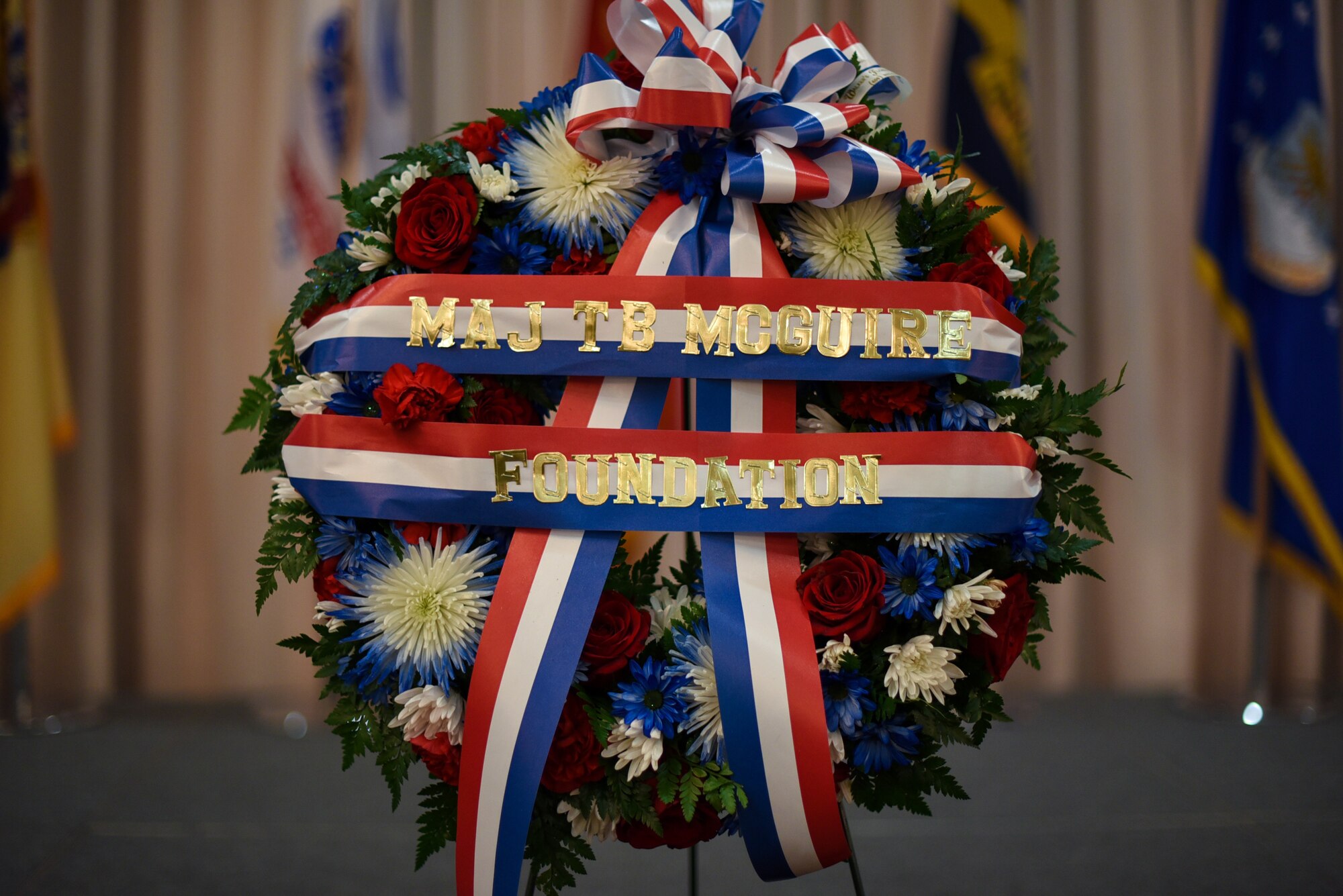 A wreath made by the Maj. Thomas B. McGuire Foundation hangs during the 37th Annual Parade of Wreaths on Joint Base McGuire-Dix-Lakehurst, New Jersey, May 23, 2019. Each wreath represented a different military service or federal law enforcement member who made the ultimate sacrifice in the name of U.S. freedom.  (U.S. Air Force photo by Airman 1st Class Ariel Owings)