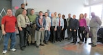 Group photo of males and females in business attire