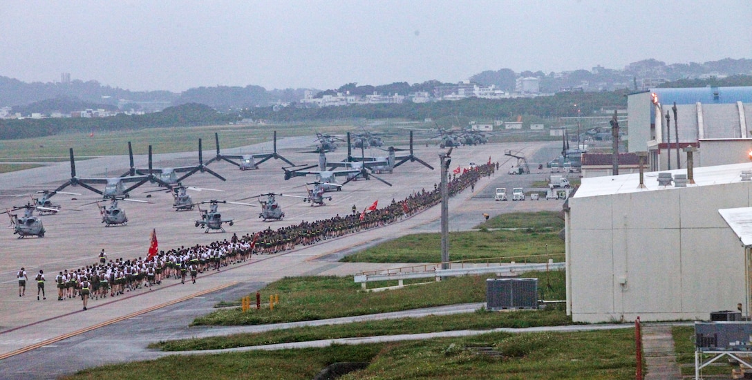 Marines with 1st Marine Aircraft Wing participate in a formation run at Marine Corps Air Station Futenma, Okinawa, Japan, May 28, 2019. Over 1,000 Marines and Sailors attended a 3 mile run around the air station flight line in order to review, refocus and recommit Marines to the mission after Memorial Day. As the aviation combat element of III Marine Expeditionary Force, 1st MAW Marines and Sailors must have the physical and mental endurance to advance in environments of extreme hardship, complexity, and pressure to perform. Motivational runs prepare 1st MAW service members to remain healthy and sustain the criteria for deployment, retention, and continued military service.