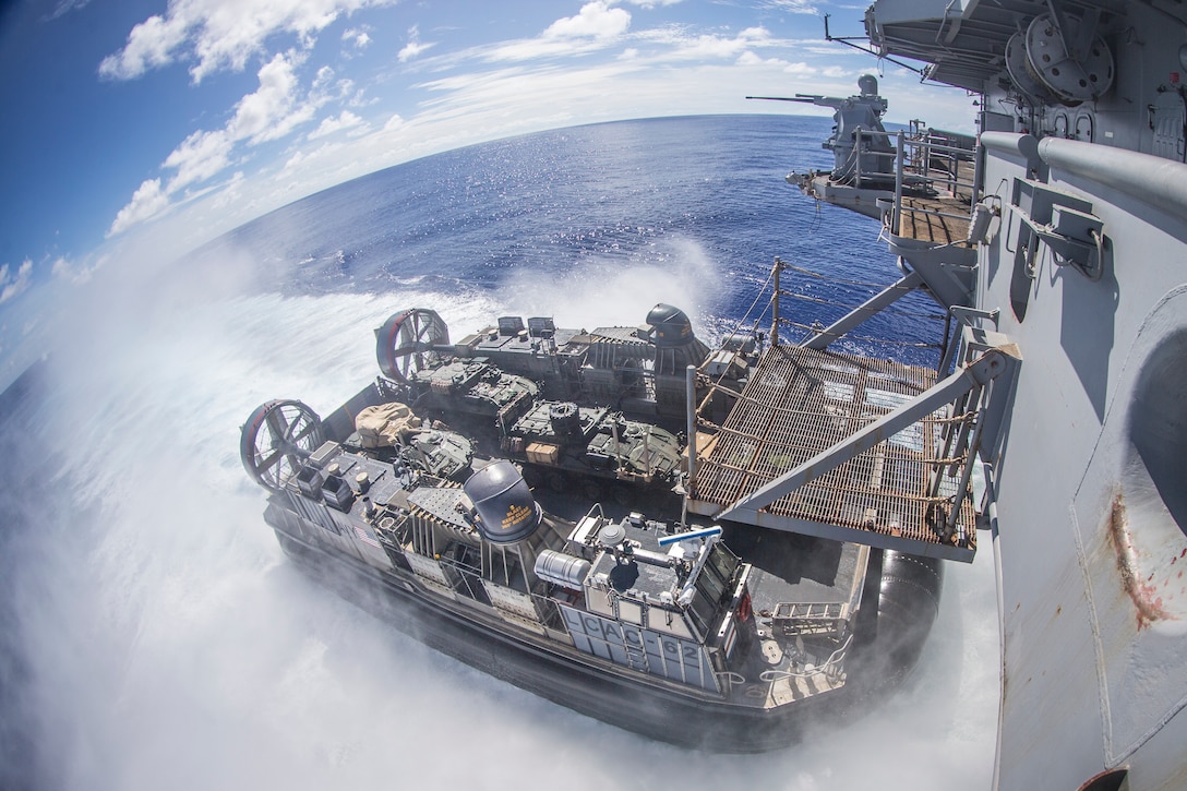 A landing craft, air cushion with Assault Craft Unit 5, departs the amphibious assault ship USS Boxer transporting light armored vehicles with Battalion Landing Team 3/5, 11th Marine Expeditionary Unit, during training operations. The Marines and Sailors of the 11th MEU are deployed to the U.S. 7th Fleet area of operations to support regional stability, reassure partners and allies, and maintain a presence postured to respond to any crisis ranging from humanitarian assistance to contingency operations.