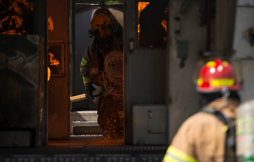 Firefighters assigned to the 628th Civil Engineer Squadron put out fires on a mobile aircraft fire training unit May 27, 2019, at Joint Base Charleston, S.C.