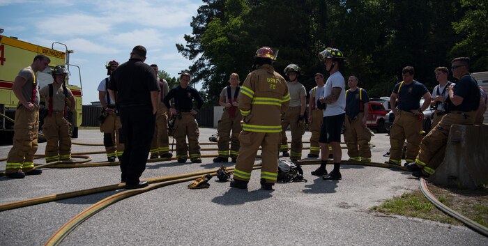 Firefighters assigned to the 628th Civil Engineer Squadron get a safety debrief May 27, 2019, at Joint Base Charleston, S.C.