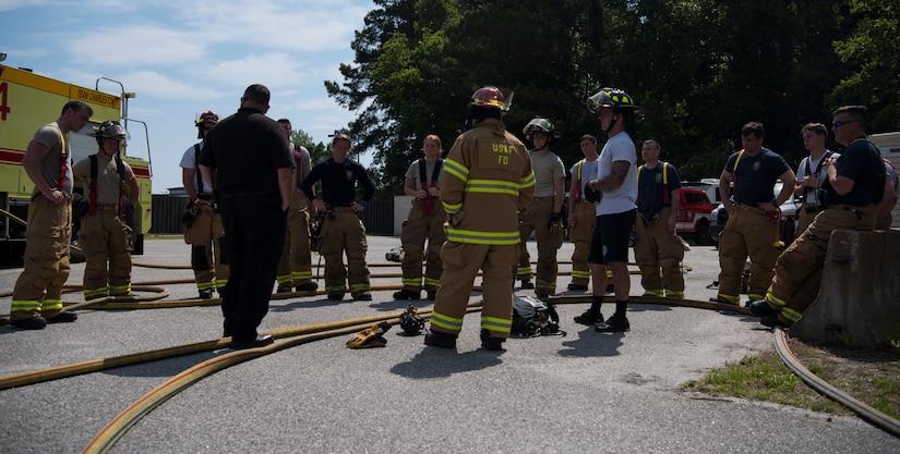 Firefighters assigned to the 628th Civil Engineer Squadron get a safety debrief May 27, 2019, at Joint Base Charleston, S.C.