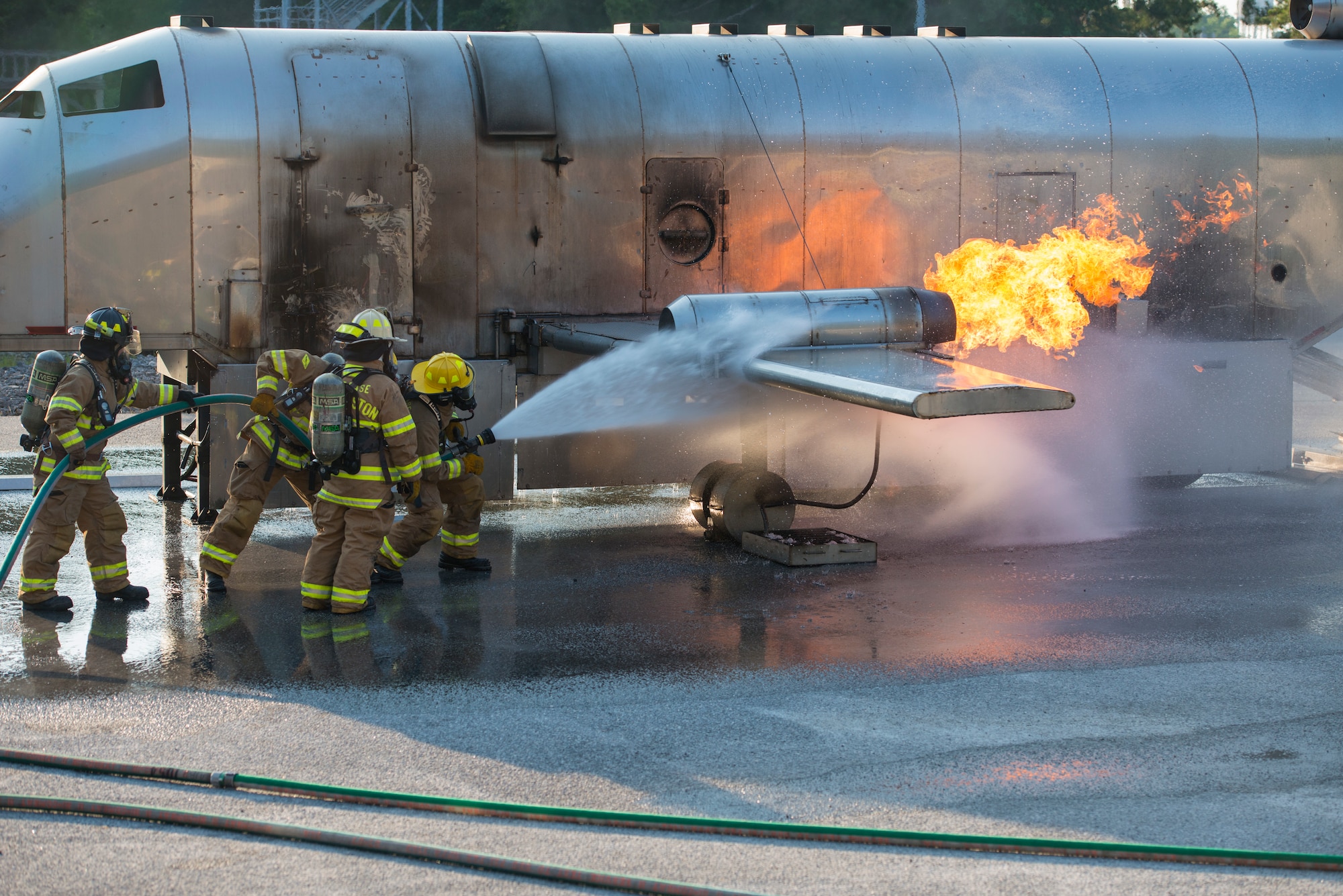 Firefighters assigned to the 628th Civil Engineer Squadron put out a fire on a mobile aircraft fire training unit May 27, 2019, at Joint Base Charleston, S.C.