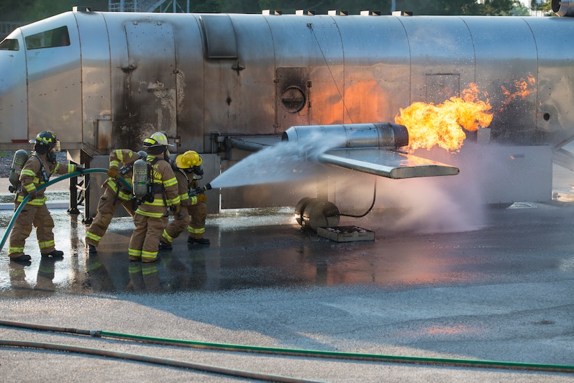Firefighters assigned to the 628th Civil Engineer Squadron put out a fire on a mobile aircraft fire training unit May 27, 2019, at Joint Base Charleston, S.C.