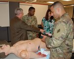 Attendees during the Strategic Medical Simulation Synchronization Summit hosted by HRCoE Directorate of Simulations May 15-16 got the opportunity to see the demonstrated capabilities of full body trauma simulation manikins.