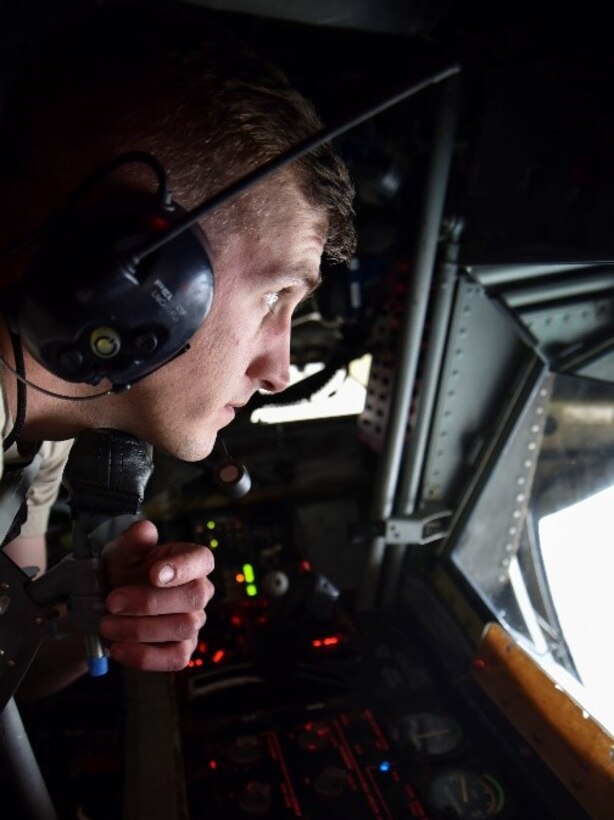 U.S. Air Force Senior Airman Jesse Weaver, 92nd Maintenance Squadron aircraft hydraulic technician, lowers the boom during an isochronal inspection on a KC-135 Stratotanker