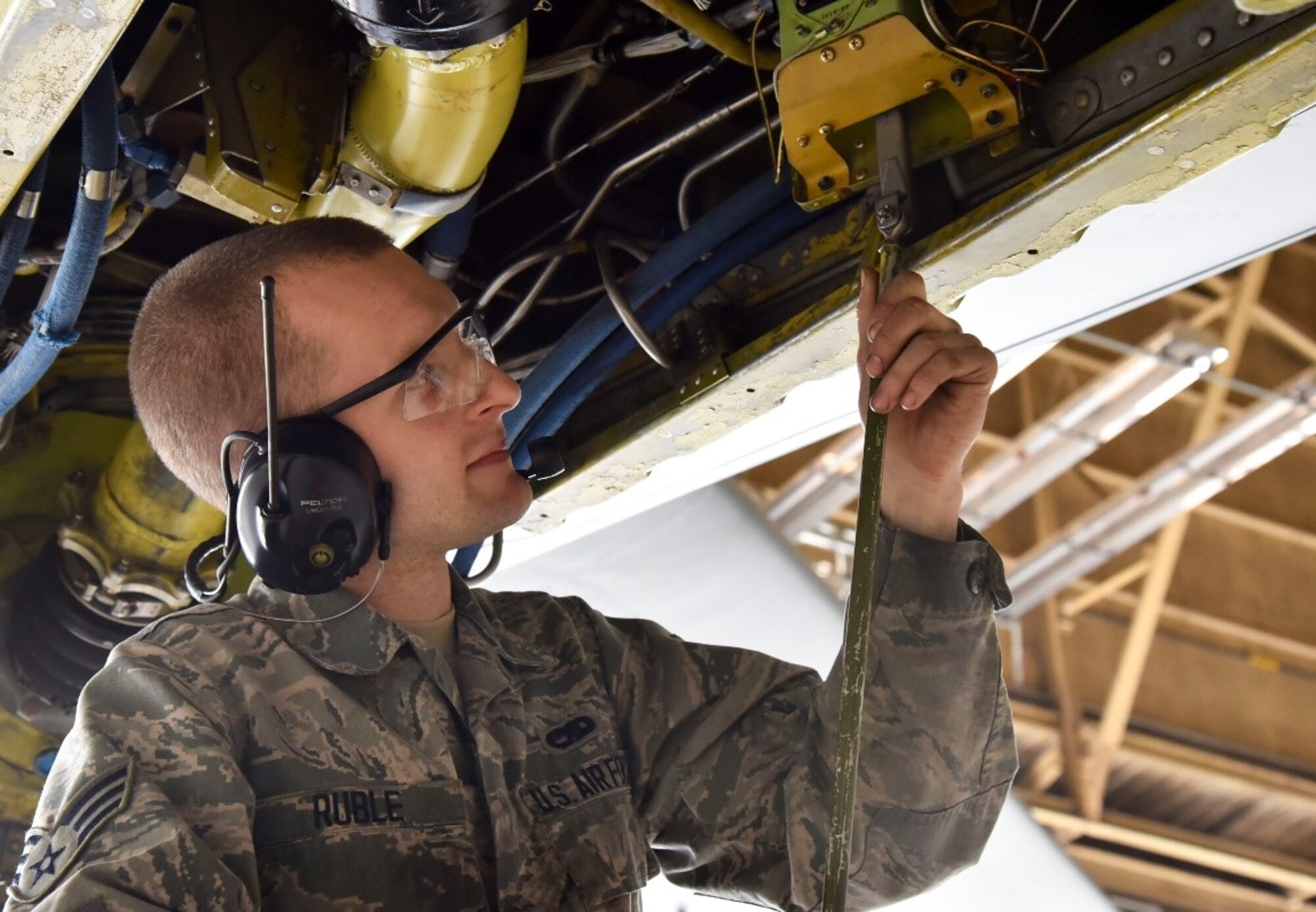 U.S. Air Force Senior Airman Isaac Ruble, 92nd Maintenance Squadron aircraft hydraulic technician, checks a KC-135 Stratotanker’s boom elevation limits during an isochronal inspection.