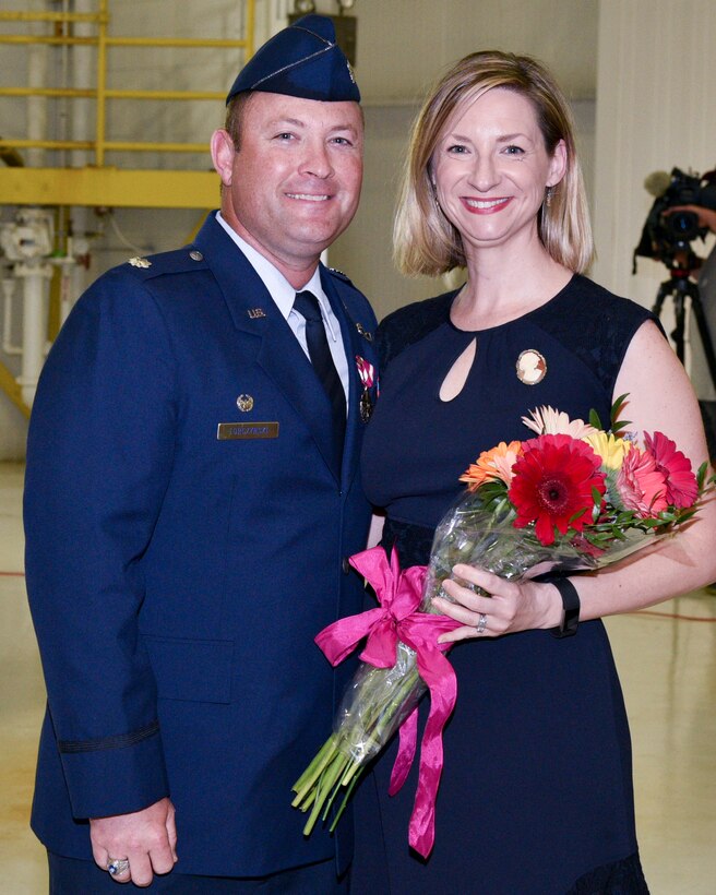 Lt. Col. Torczynski Presents Flowers To Mrs. Torczynski