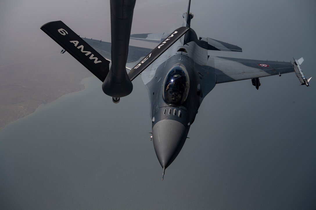 An Iraqi Air Force F-16 Fighting Falcon approaches the boom of a U.S. Air Force KC-135 Stratotanker during a training mission above Iraq May 26, 2019. The Coalition Aviation Advisory and Training Team in partnership with the Office of Security Cooperation-Iraq, provides training, advising and assistance in addition to building partner capacity for Iraqi Army Aviation Command, Iraqi Air Defense Command and the Iraqi Air Force.