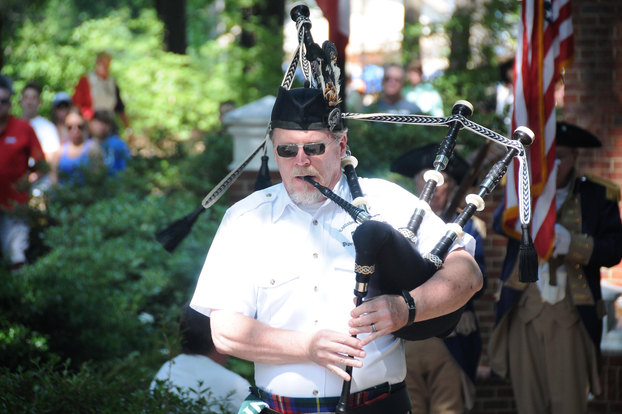 A bagpiper plays during the start of the Roswell Memorial Day Ceremony at Roswell City Hall area, Roswell, GA on May 27, 2019. At the event, all branches of the military were represented and individual service representatives from each branch participated in the mixed service recognition portion of the program. (U.S. Air Force photo by Senior Airman Justin Clayvon).