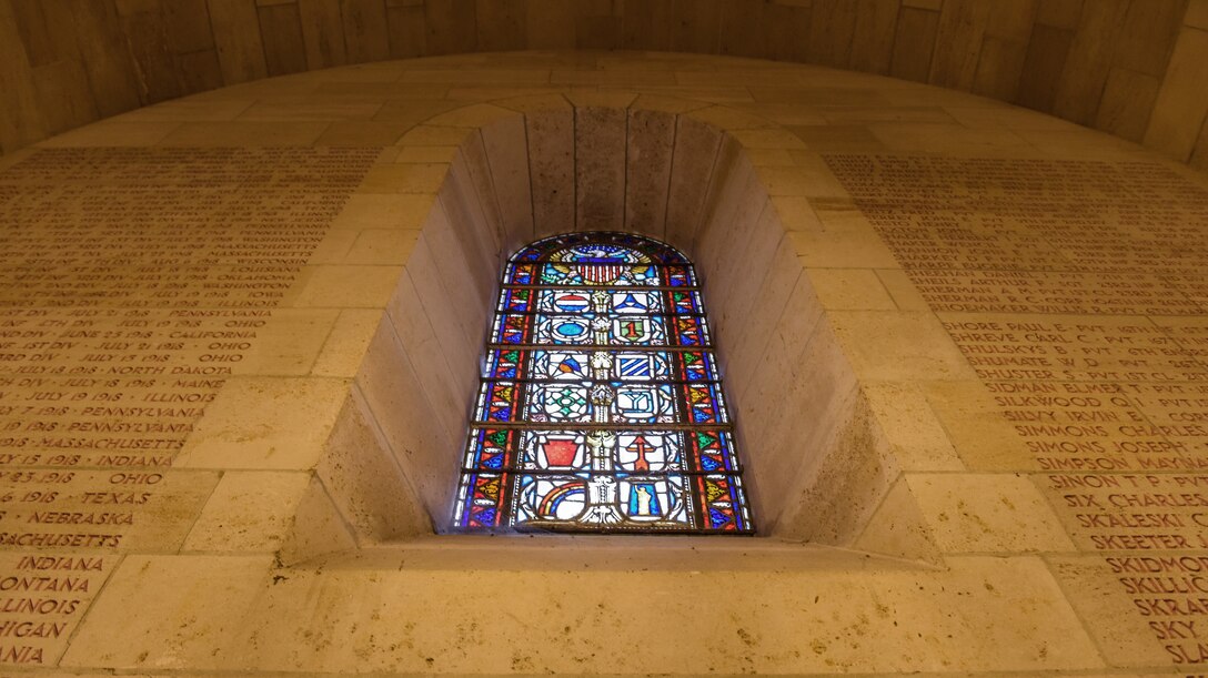 The Aisne-Marne American Chapel sits at foothill of Belleau Wood, contains the graves of 2,289 war dead. Inscribed on its walls are the names of 1,060 missing personnel. A monument at the flagpole commemorates the valor of the U.S. Marines who captured much of this ground in 1918.