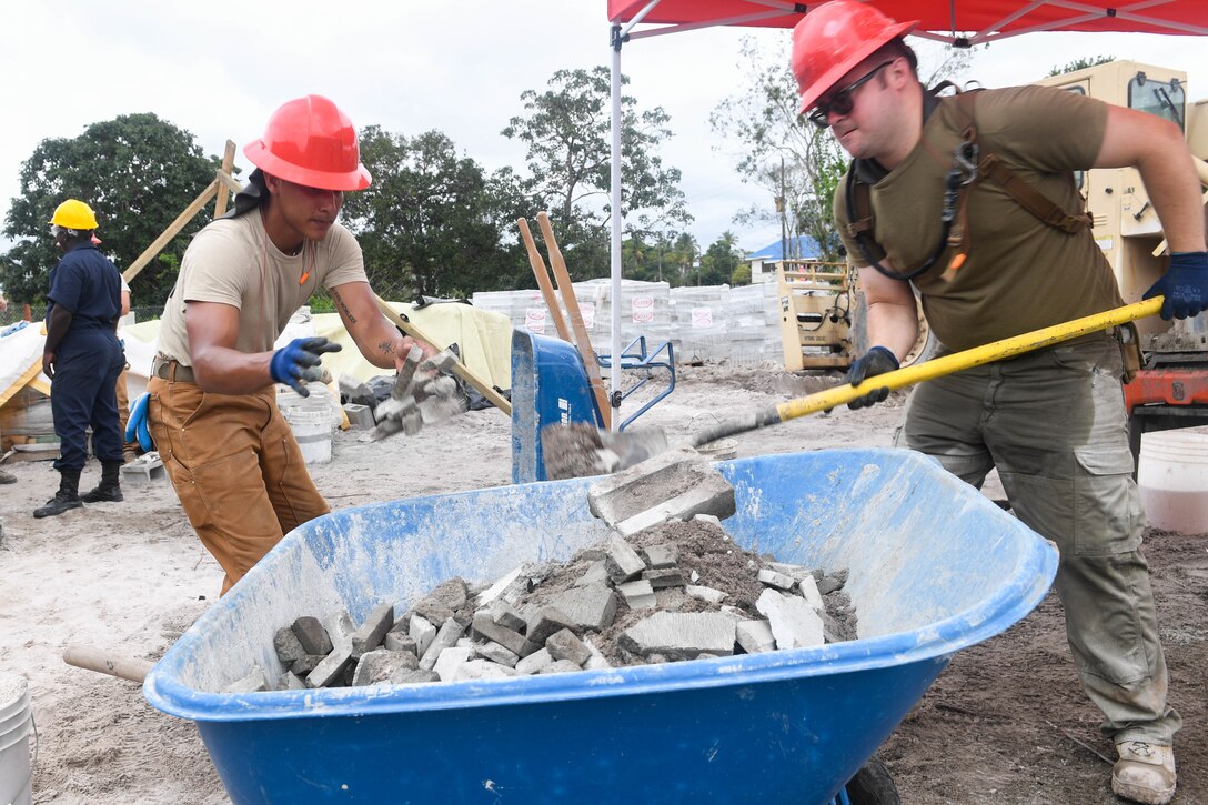 U.S. Air Force engineers clean debris at a construction site in Guyana.