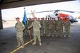 Maj. Amoreena York, Col. Mark Ott, and Maj. Mark Axtell walk to their seats after passing the guidon signaling the transfer of leadership of Aviation Company (AVCO), Task Force Sinai,  South Camp, Egypt, May 23, 2019. AVCO is a self-sustaining aviation company, enhanced with all the support elements of a traditional aviation battalion.