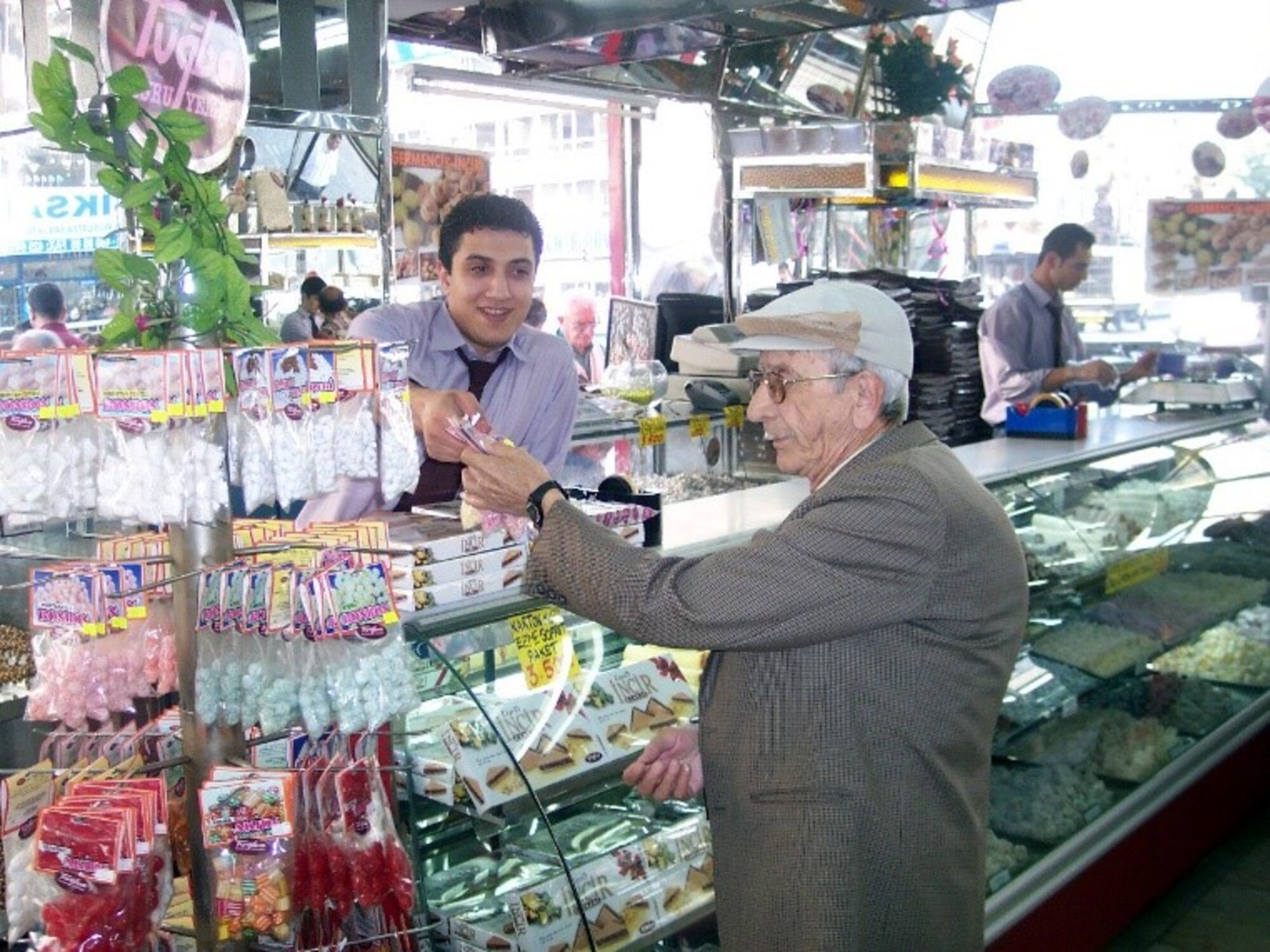 A local man prepares to celebrate the Ramazan Holiday or Sugar Holiday, which starts on June 4 and ends June 6 in Izmir, Turkey. Candy sales normally skyrocket during the Sugar Holiday when it is customary to present family, friends and co-workers with delicious treats. (Photo by Tanju Varlıklı)