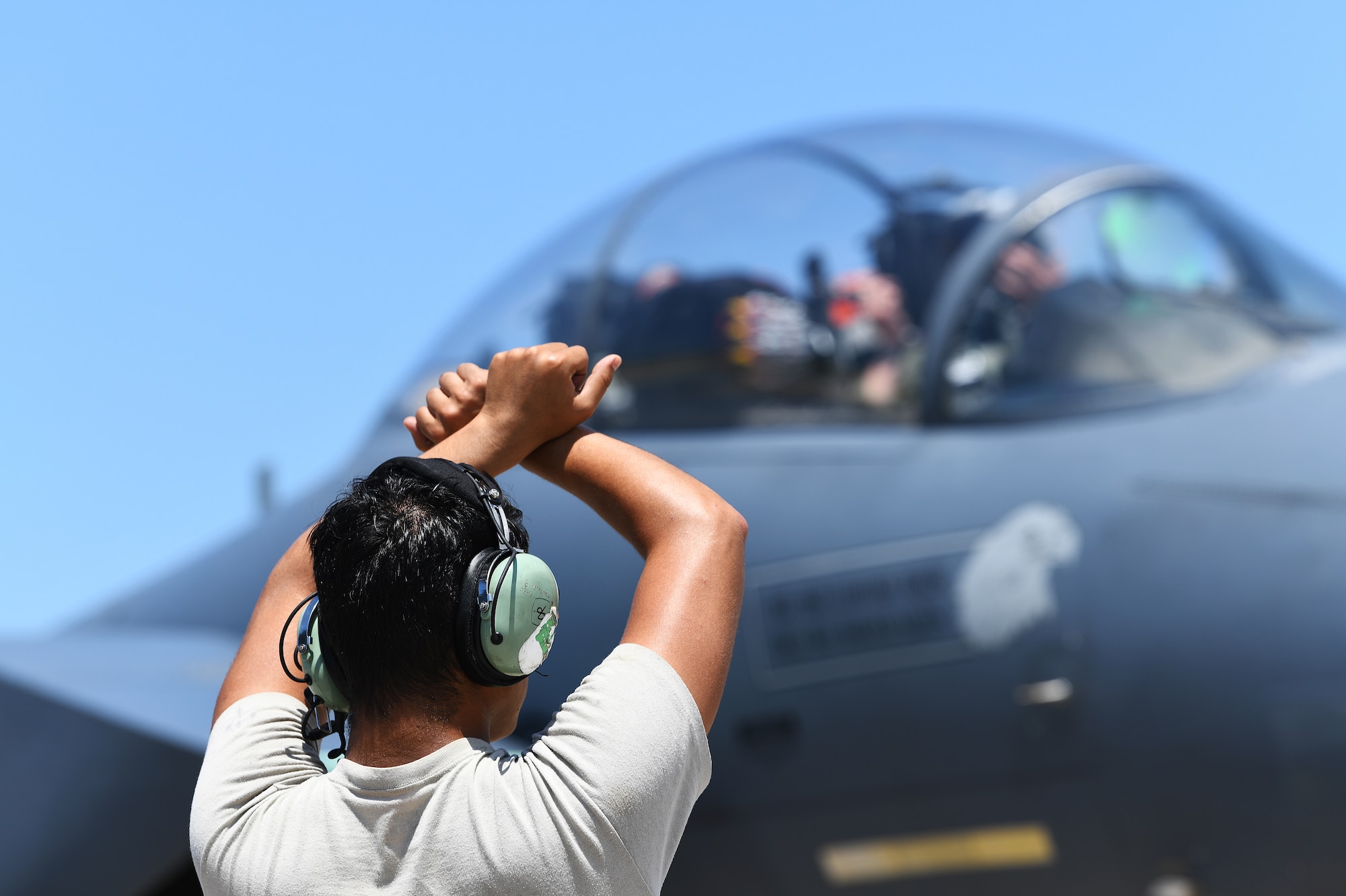 A 494th Aircraft Maintenance Unit crew chief marshals an F-15E Strike Eagle in support of exercise Checkered Flag 19-1 at Tyndall Air Force Base, Florida, May 20, 2019. The exercise allowed maintenance personnel assigned to the 494th AMU to be evaluated through Weapons Systems Evaluation Programs and provided less experienced aircrew valuable live-fire training. (U.S. Air Force photo by Airman 1st Class Shanice Williams-Jones)