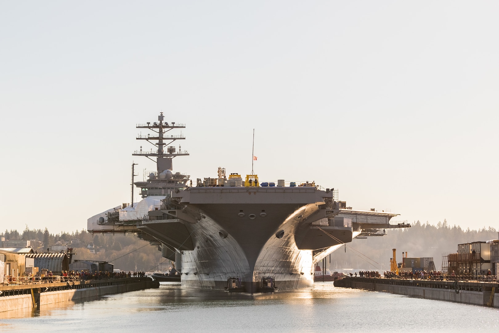 USS Nimitz (CVN 68) departs Dry Dock 6 at Puget Sound Naval Shipyard & Intermediate Maintenance Facility in Bremerton, Wash., Dec. 5, 2018.