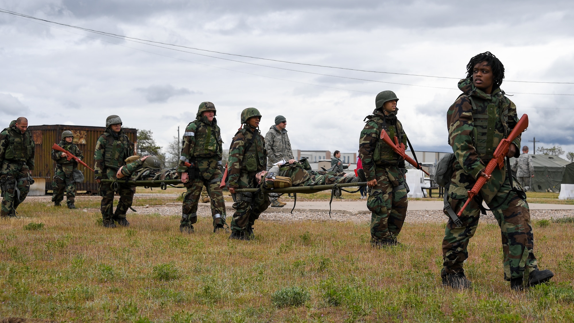 Airmen evacuate simulated casualties during a Contracting Directorate field exercise at Hill Air Force Base, Utah, May 22, 2019. The exercise simulated scenarios specific to the contracting mission in a deployed environment. Contracting specialists purchase supplies and services essential to operational continiuty and mission success. (U.S. Air Force photo by R. Nial Bradshaw)