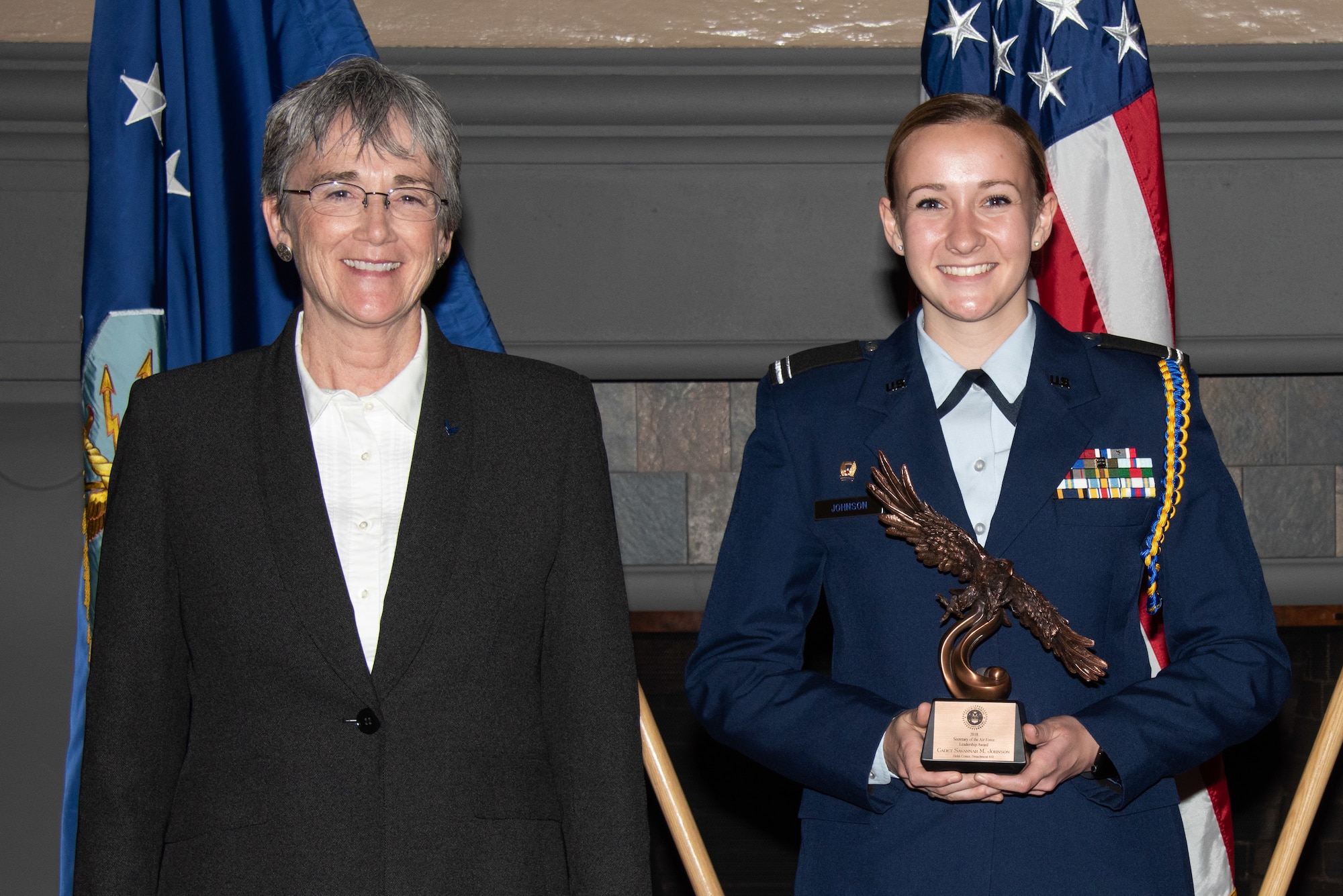 Secretary of the Air Force Heather Wilson, left, presents Capt. Savannah Johnson, Air Force Reserve Officer Training Corps, Detachment 410, University of Saint Thomas, Saint Paul, Minnesota, right, with the 2019 Secretary of the Air Force Leadership Award May 14, 2019, at Maxwell Air Force Base, Alabama. Johnson is the top cadet in her class in a detachment ranked in the top ten percent nationwide, maintaining a 3.9 grade point average in Mechanical Engineering and being on the Dean’s List every semester. She also finished in the top one percent of her as a Distinguished Graduate during her Field Training, securing a recommendation to return as a Cadet Training Assistant.