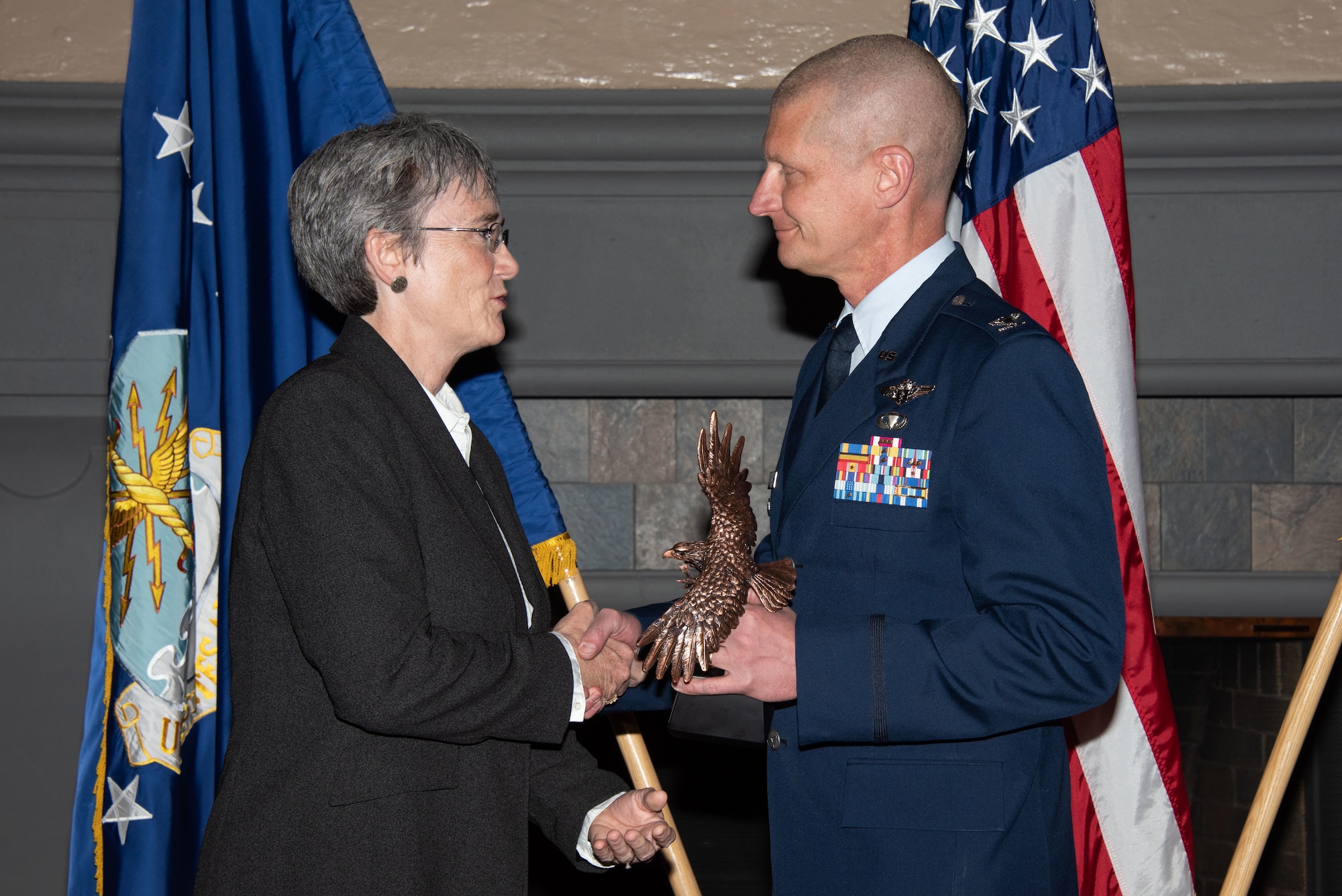 Secretary of the Air Force Heather Wilson, left, presents Col. Paul Nelson, Air Force Surgeon General’s Chair to Air University, right, with the 2019 Secretary of the Air Force Leadership Award May 14, 2019, at Maxwell Air Force Base, Alabama. Nelson led a sustained four-year effort, culminating in partnerships with the joint medical services, media, military and civilian academia, reframing medical support for high-end combat operations. Additionally, he aligned efforts to address education concerns of military families in the Alabama River Region, nurtured diversity in STEM programs nationwide and built partnerships impacting thousands of local students.