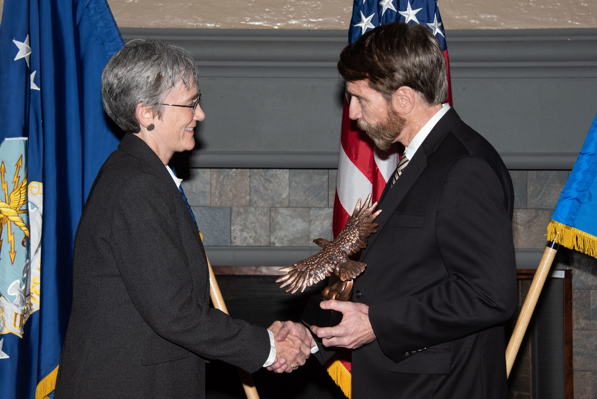 Secretary of the Air Force Heather Wilson, left, presents Dr. Jeffrey Reilly, Air Command and Staff College Future Security Studies director, right, with the 2019 Secretary of the Air Force Leadership Award May 14, 2019, at Maxwell Air Force Base, Alabama. Dr. Reilly worked with Indo-Pacific Command, Africa Command, United States Army Training and Doctrine Command, Defense Threat Reduction Agency, the U.S. Department of State and German, Polish and Danish military colleges to develop the Multi-Domain Operational Strategists concentration, embracing the new 130 Multi-Domain career field and the 11F Fellowship immersion program.