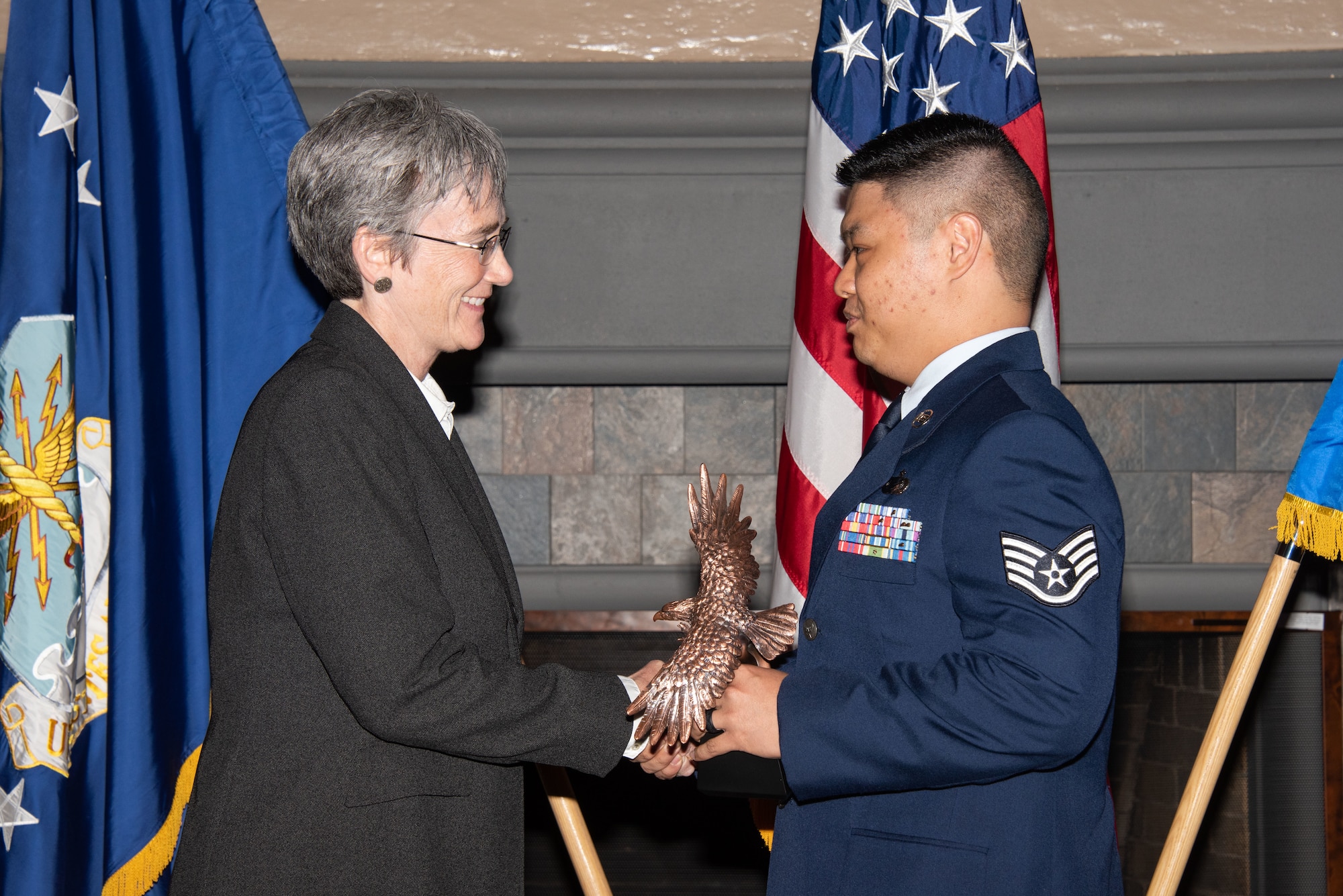 Secretary of the Air Force Heather Wilson, left, presents Staff Sgt. John Condol, 22nd Training Support Squadron assignments NCOIC, right, with the 2019 Secretary of the Air Force Leadership Award May 14, 2019, at Maxwell Air Force Base, Alabama. Condol oversaw a three-person team, driving the success of 800 trainee assignments, 1,100 permanent change of station orders and 196 security clearance investigations. In addition, he coordinated an Air Force Personnel Center site visit, improving timelines and communication between AFPC and the Officer Training School.