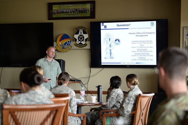 Roger Swartz, Keesler Office of Emergency Management emergency management plan specialist, delivers the base emergency preparedness orientation at the base newcomer's briefing inside the Bay Breeze Event Center at Keesler Air Force Base, Mississippi, May 22, 2019. The base emergency preparedness orientation is to inform new base personnel about the natural disasters that threaten the area and how to prepare for them. (U.S Air Force Photo by Airman 1st Class Spencer Tobler)