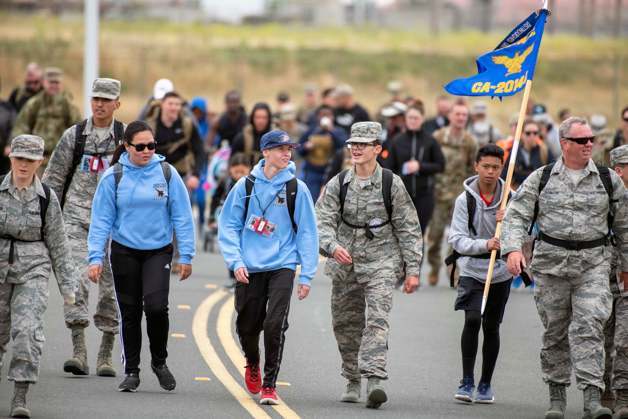 Over 200 people participate in the 9th annual Gold Star Families 10K Ruck March at Travis Air Force Base, California, May 18, 2019. The ruck march honored 22 Gold Star families and their loved ones who lost their lives while serving their country. (U.S. Air Force photo by Louis Briscese)