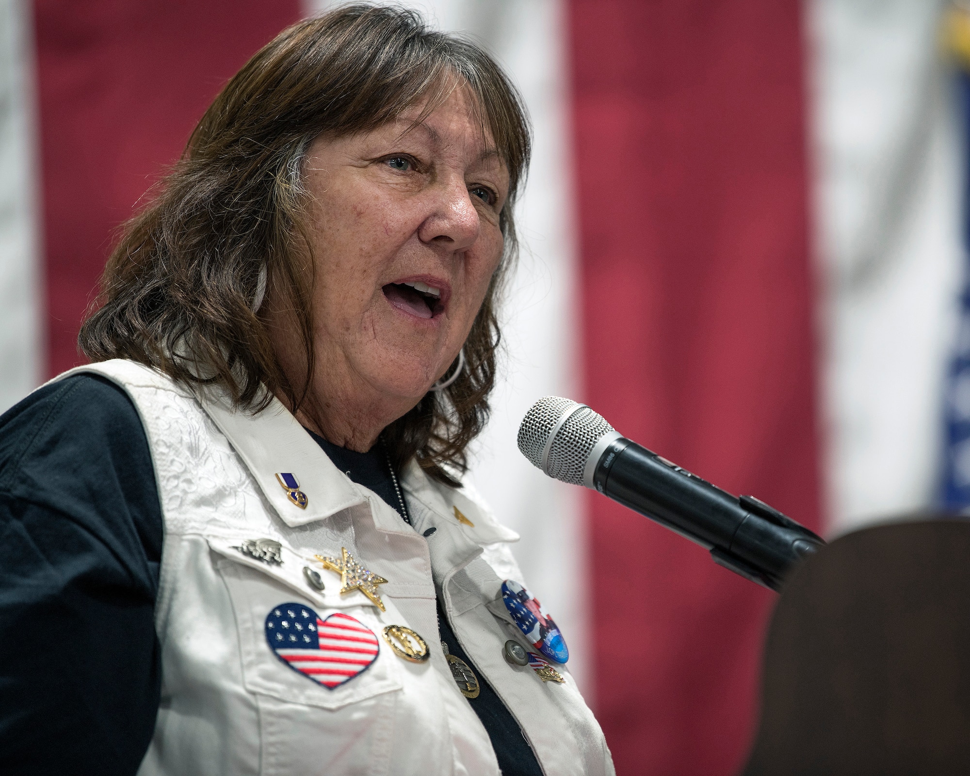 Diane Layfield, the mother of Lance Cpl. Travis Layfield provides remarks during the 9th annual Gold Star Families 10K Ruck March at Travis Air Force Base, California, May 18, 2019. The ruck march honored 22 Gold Star families and their loved ones who lost their lives while serving their country. (U.S. Air Force photo by Louis Briscese)