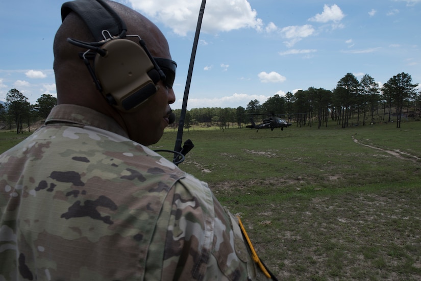 U.S. Army Sgt. 1st Class Phillip Webb, 1st Battalion 228th Aviation Regiment detachment first sergeant, alerts of simulated aircraft casualties during a search and rescue exercise, May 21, 2019, in Comayagua, Honduras. Members from various units on Joint Task Force – Bravo participated in the exercise that simulated a HH-60 Blackhawk crashed during a routine flight carrying personnel. The exercise practiced notification, recall, search and rescue, on-scene medical care, recovery of personnel from low and high angle austere terrain, and medical care once the injured returned to base. (U.S. Air Force photo by Staff Sgt. Eric Summers Jr.)