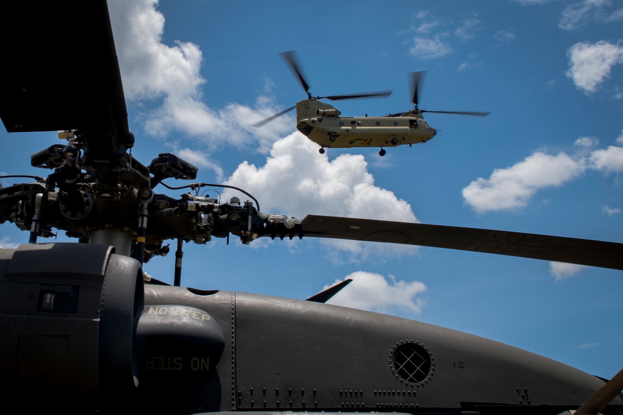 A CH-47 Chinook from the 1st Battalion 228th Aviation Regiment, carrying first responders, arrives at the scene of simulated helicopter crash during a search and rescue exercise, May 21, 2019, in Comayagua, Honduras. Members from various units on Joint Task Force – Bravo participated in the exercise that simulated a HH-60 Blackhawk crashed during a routine flight carrying personnel. The exercise practiced notification, recall, search and rescue, on-scene medical care, recovery of personnel from low and high angle austere terrain, and medical care once the injured returned to base. (U.S. Air Force photo by Staff Sgt. Eric Summers Jr.)