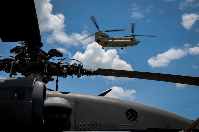 A CH-47 Chinook from the 1st Battalion 228th Aviation Regiment, carrying first responders, arrives at the scene of simulated helicopter crash during a search and rescue exercise, May 21, 2019, in Comayagua, Honduras. Members from various units on Joint Task Force – Bravo participated in the exercise that simulated a HH-60 Blackhawk crashed during a routine flight carrying personnel. The exercise practiced notification, recall, search and rescue, on-scene medical care, recovery of personnel from low and high angle austere terrain, and medical care once the injured returned to base. (U.S. Air Force photo by Staff Sgt. Eric Summers Jr.)