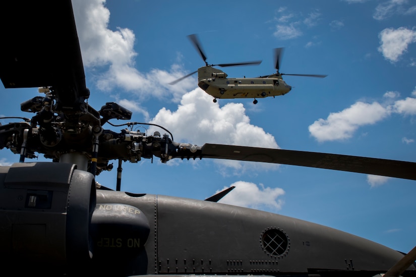 A CH-47 Chinook from the 1st Battalion 228th Aviation Regiment, carrying first responders, arrives at the scene of simulated helicopter crash during a search and rescue exercise, May 21, 2019, in Comayagua, Honduras. Members from various units on Joint Task Force – Bravo participated in the exercise that simulated a HH-60 Blackhawk crashed during a routine flight carrying personnel. The exercise practiced notification, recall, search and rescue, on-scene medical care, recovery of personnel from low and high angle austere terrain, and medical care once the injured returned to base. (U.S. Air Force photo by Staff Sgt. Eric Summers Jr.)