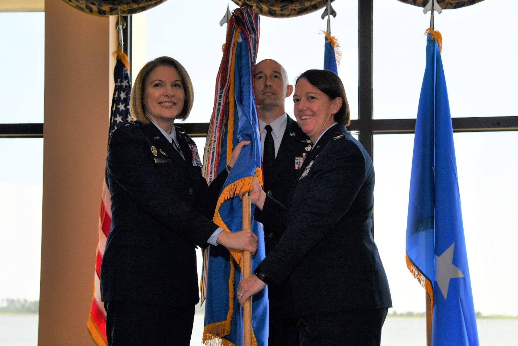 U.S. Air Force Maj. Gen. Mary F. O’Brien, Twenty-Fifth Air Force commander, passes the guidon to Col. Melissa A. Stone during the 363d Intelligence, Surveillance and Reconnaissance Wing assumption of command ceremony at Joint Base Langley-Eustis, Virginia, May 30, 2019. The 363d ISRW conducts lethal, resilient and ready operations across four key mission areas: analysis of air, space and cyber operations; full-spectrum targeting; special operations ISR; and ISR testing, tactics development and advanced training. (U.S. Air Force photo by Robert Mehal)