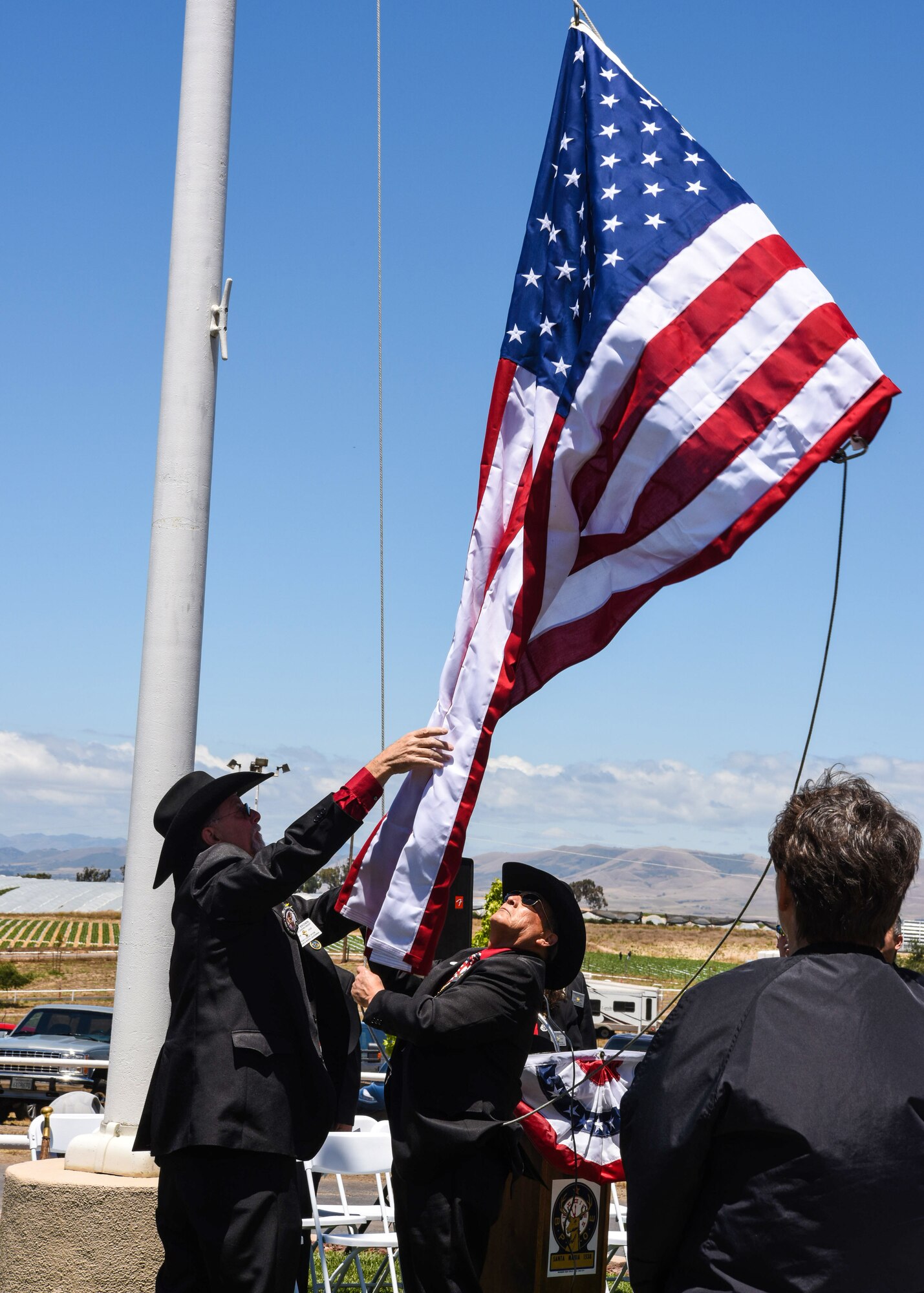 Wes Brown, Santa Maria Elks Lodge leading knight, and Tony Campas, Santa Maria Elks Lodge exalted ruler, raise the American flag during a Memorial Day ceremony May 27, 2019, in Santa Maria, Calif.