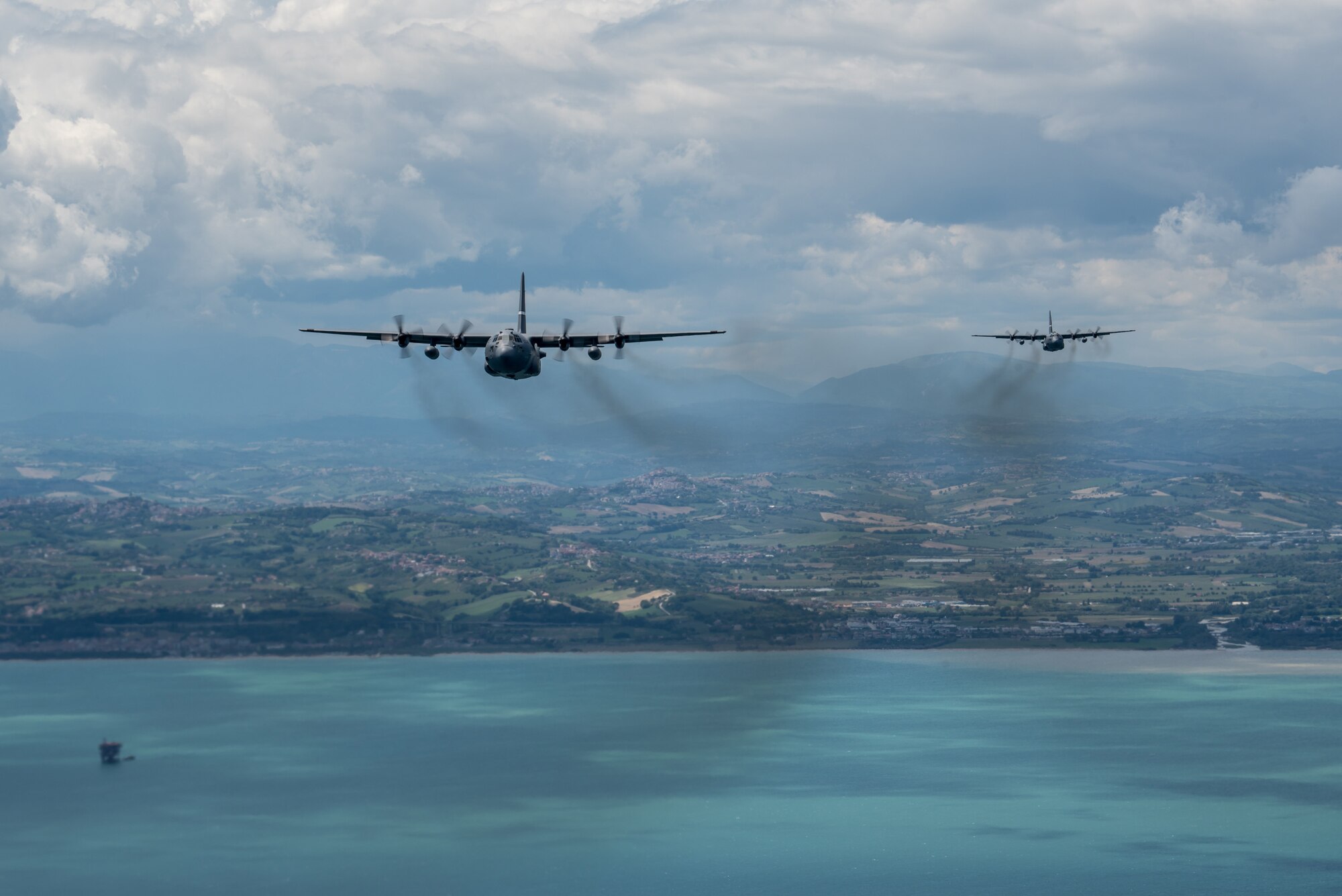 Kentucky Air National Guard C-130 Hercules aircraft conduct a nonstandard-load training flight in the airspace above Venice, Italy, May 20, 2019, while carrying equipment from U.S. Army Europe’s 173rd Airborne Brigade Combat Team as part of Immediate Response 2019. The exercise is designed to improve readiness and interoperability among participating allied and partner nations integrated into a multinational battalion. Combined training enables allies and partners to readily respond more effectively to regional crises and meet their own national defense goals. (U.S. Air National Guard photo by Staff Sgt. Horton)