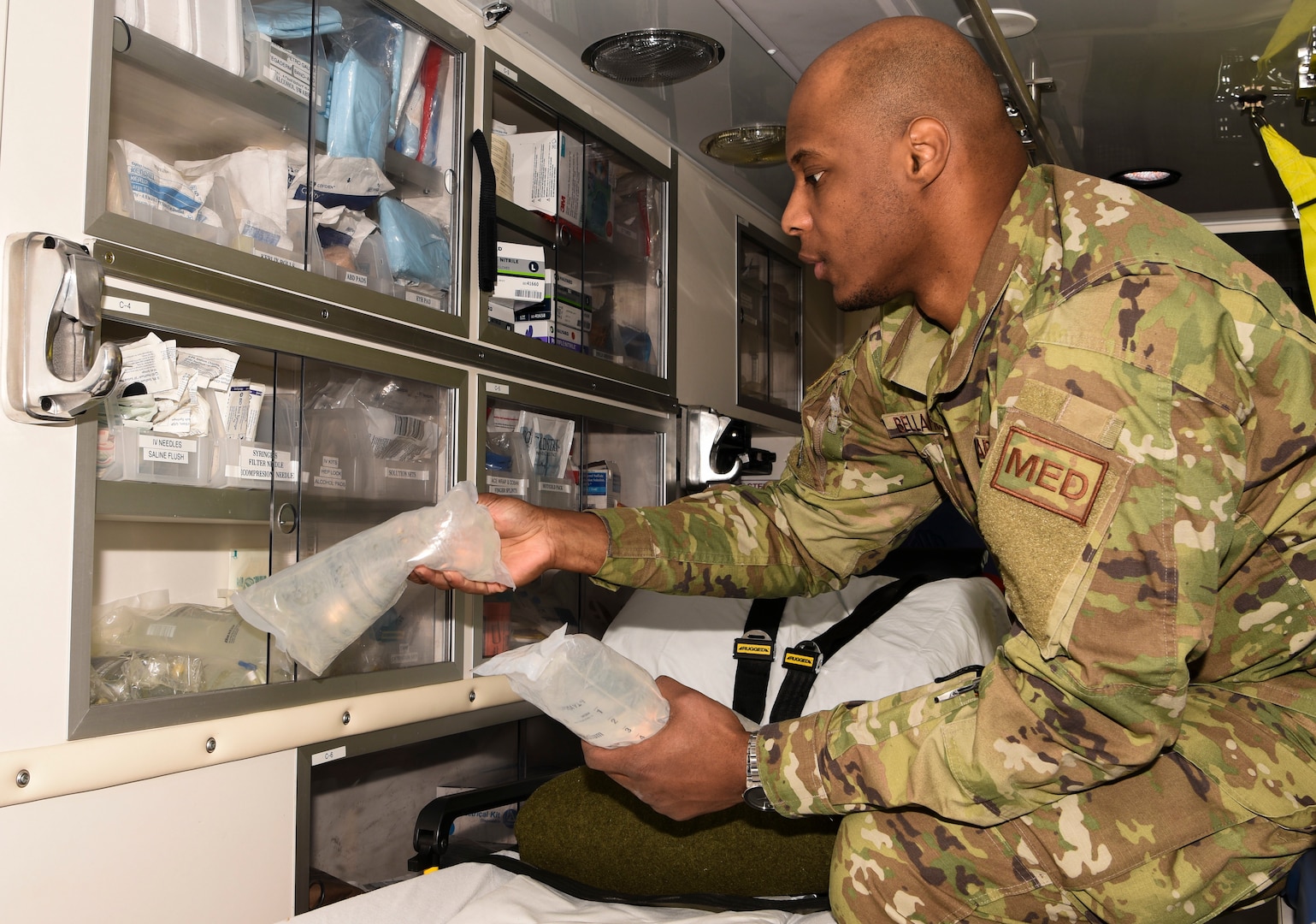 Senior Airman Gibbs Bellamour, 5th Medical Operations Squadron aerospace medical technician, organizes supplies in an ambulance storage space at Minot Air Force Base, North Dakota, April 4, 2019.