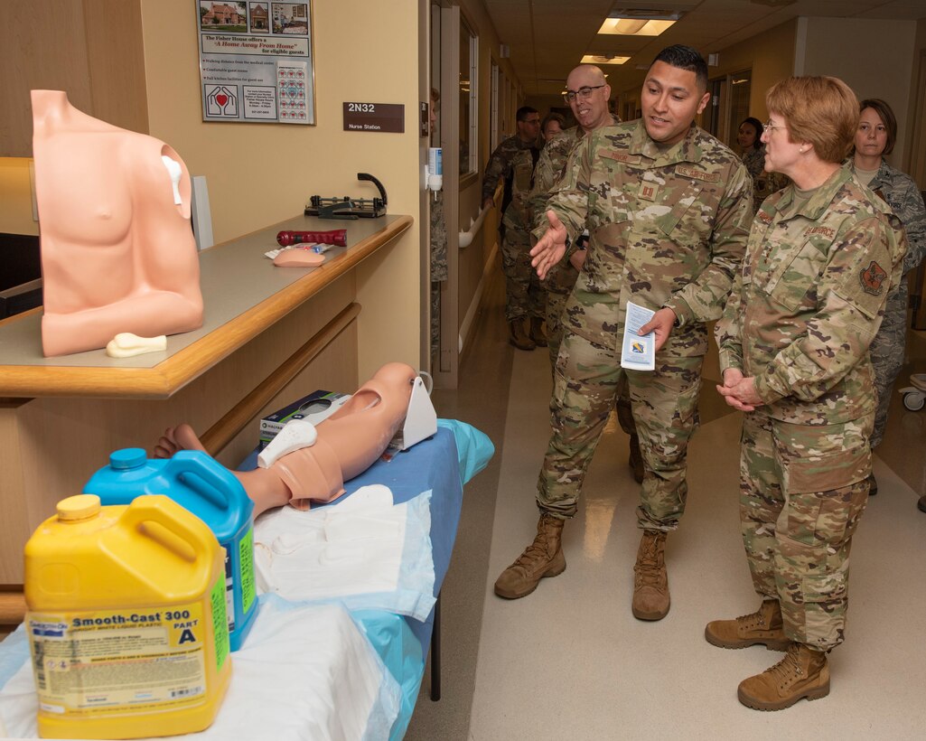 U.S. Air Force Capt. Christopher Minor, 88th Medical Group registered nurse, shows Lt. Gen. Dorothy A. Hogg, U.S. Air Force Surgeon General, custom-made prosthetics made for the patient simulation lab at Wright-Patterson Air Force Base Medical Center, Ohio, May 23, 2019. Hogg toured various locations in the hospital, such as the emergency medicine department, diagnostic imaging, operating room, simulation center, and medical-surgical unit. (U.S. Air Force photo by Michelle Gigante)