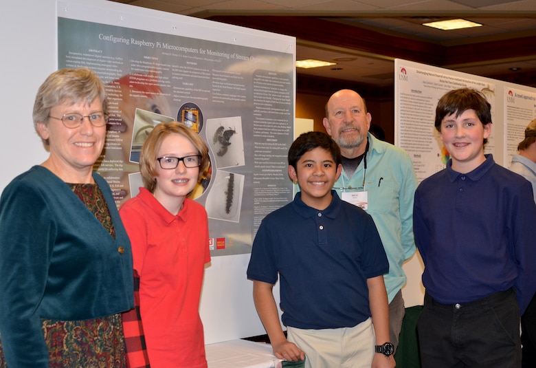 Mesa Del Sol students with their poster, at the 52nd Joint Annual Meeting of the Arizona and New Mexico Chapters of the Wildlife Society and American Fisheries Society, held Feb. 7, 2019, in Albuquerque, N.M. (l-r): Mary Fox, science teacher; Addison Epps, student; Kyle Llonoso, student; Michael Porter, fishery biologist; and Logan Guerrero, student.