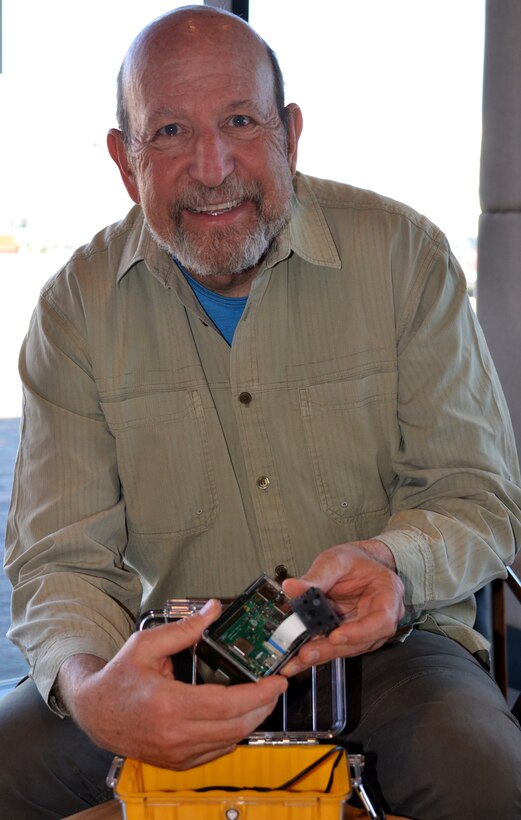 Michael Porter, fishery biologist, holds one of the Raspberry Pi computers being utilized by students at Mesa Del Sol Middle School.