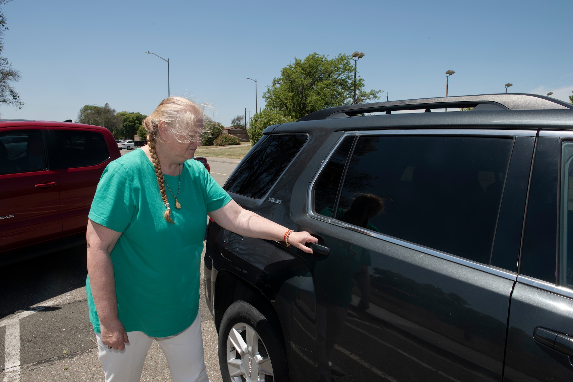 Heide Couch, 60th Air Mobility Wing photographer, prepares to enter a vehicle May 30, 2019 at Travis Air Force Base, California. Before entering a vehicle driven by a ride-share driver, passengers should confirm the driver’s identity and ensure they are entering the correct vehicle. (U.S. Air Force photo by Tech. Sgt. James Hodgman)