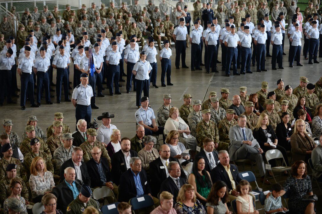 Airmen from across the 28th Bomb Wing stand in formation at the change of command ceremony held at the PRIDE Hangar on Ellsworth Air Force Base, S.D., May 30, 2019. The ceremony is a time-honored military tradition that serves as representation of the exchange of responsibility and authority from one commander to another. (U.S Air Force photo by Master Sgt. Kenya Shiloh)