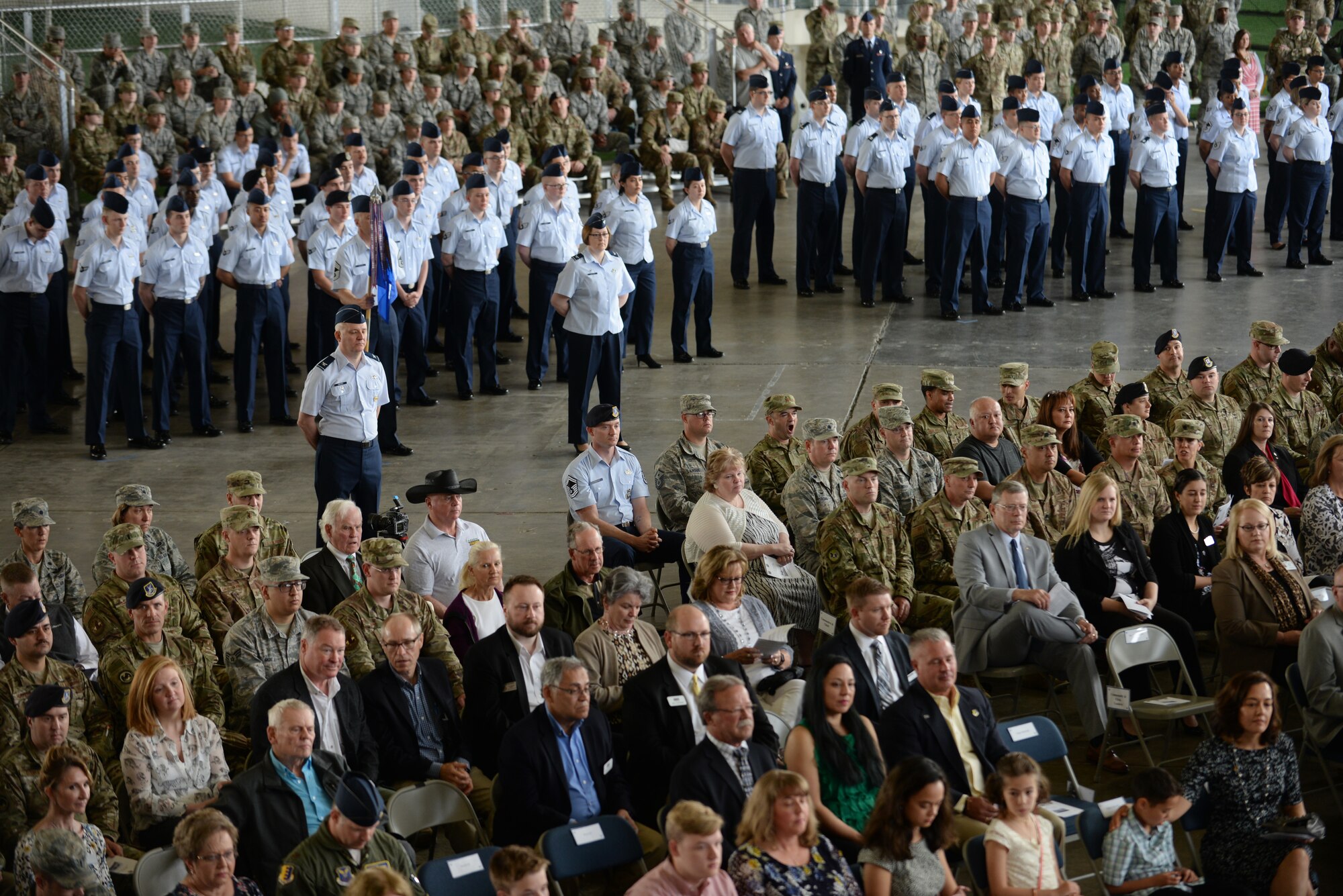 Airmen from across the 28th Bomb Wing stand in formation at the change of command ceremony held at the PRIDE Hangar on Ellsworth Air Force Base, S.D., May 30, 2019. The ceremony is a time-honored military tradition that serves as representation of the exchange of responsibility and authority from one commander to another. (U.S Air Force photo by Master Sgt. Kenya Shiloh)