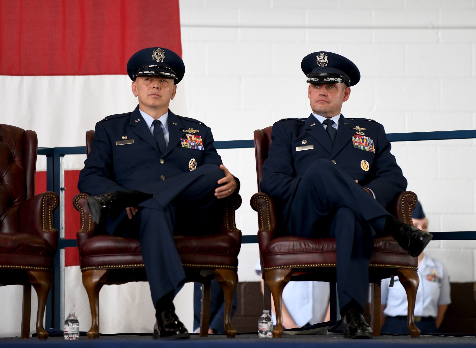 Col. John Edwards, the outgoing commander of the 28th Bomb Wing, and Col. David A. Doss, the incoming commander, listen as Maj. Gen. James Dawkins Jr., the 8th Air Force commander, delivers a speech during a ceremony on Ellsworth Air Force Base, S.D., May 30, 2019.  As commander, Doss will take over responsibility of the base including more than 3,700 total-force Airmen and a fleet of 27 B-1B Lancers. (U.S. Air Force photo by Airman 1st Class Christina Bennett)