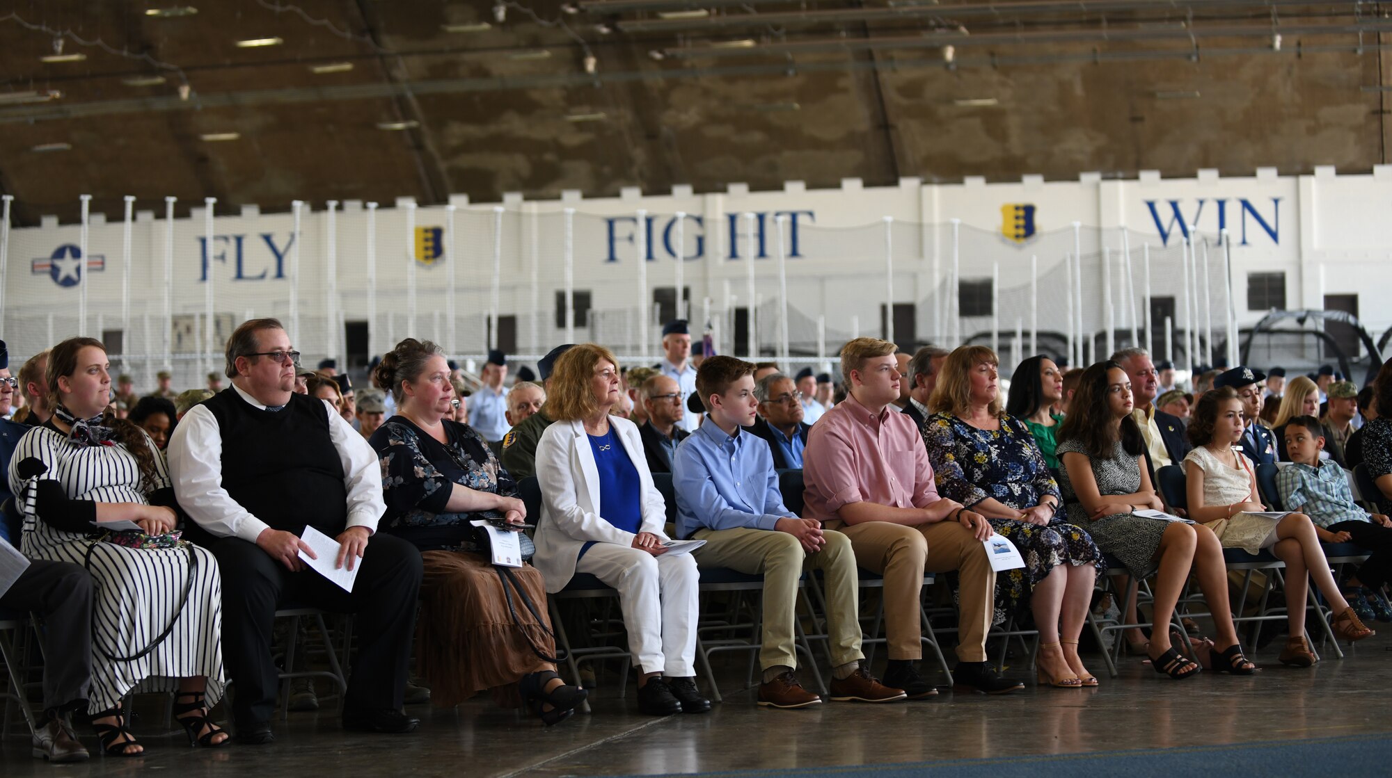 The family of Col. David A. Doss, the 28th Bomb Wing commander, sits alongside the family of outgoing commander, Col. John Edwards at a change of command ceremony on Ellsworth Air Force Base, S.D., May 20, 2019. As commander, Doss will take responsibility of the base and more than 3,700 total-force Airmen as well as a fleet of 27 B-1B Lancers. (U.S. Air Force photos by Airman 1st Class Christina Bennett)