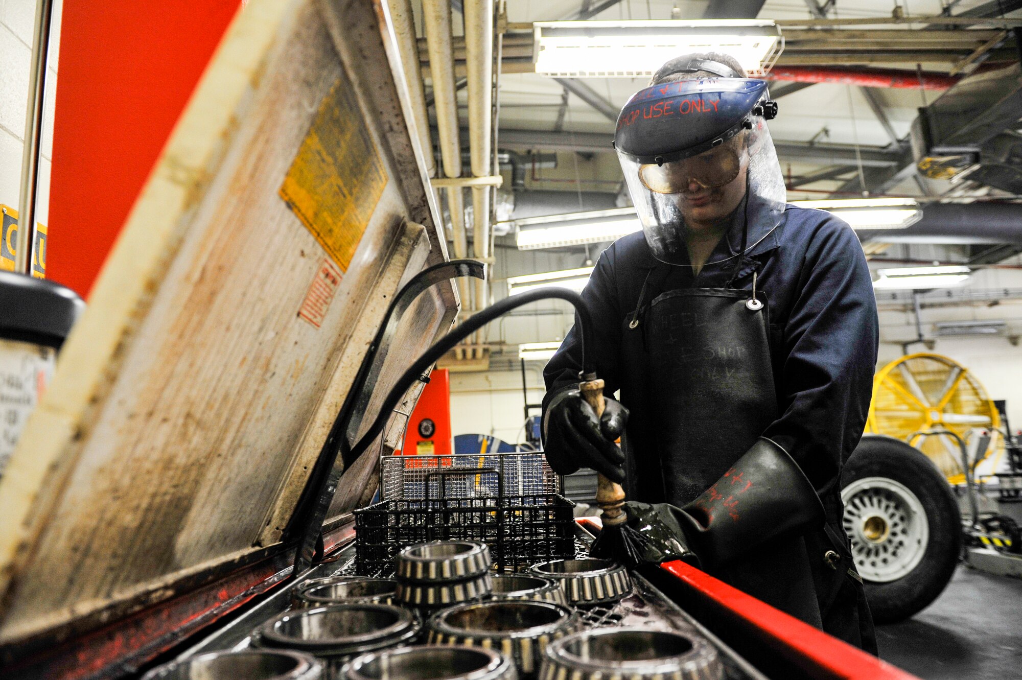 U.S. Air Force Senior Airman Landon Berry, wheel and tire technician assigned to the 18th Equipment Maintenance Squadron, cleans the aircraft wheel bearings at Kadena Air Base, Japan, May 22, 2019.