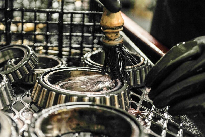 U.S. Air Force Senior Airman Landon Berry, wheel and tire technician assigned to the 18th Equipment Maintenance Squadron, cleans the aircraft wheel bearings at Kadena Air Base, Japan, May 22, 2019.