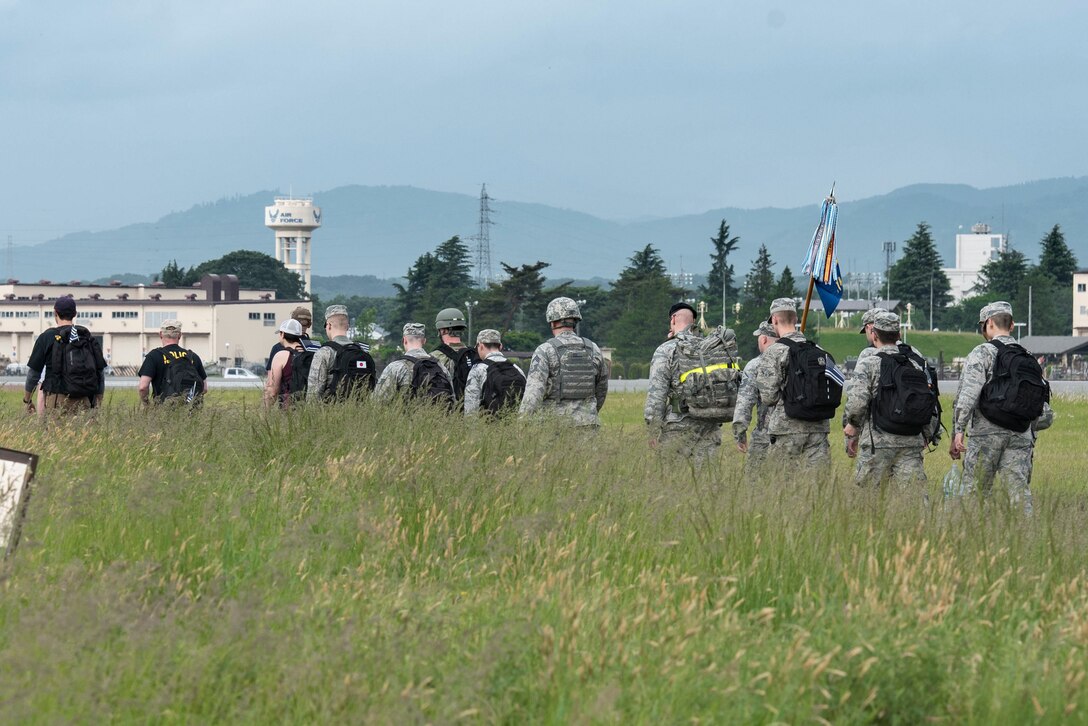 Airmen participate in Yokota’s 2019 National Police Week 5K Ruck March, May 20, 2019, at Yokota Air Base, Japan.