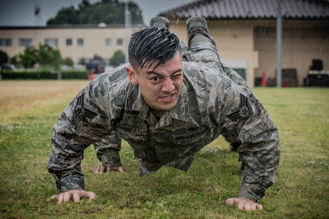 Senior Airman Shain Chairez, 374th Security Forces Squadron response force leader, performs team pushups during Yokota’s 2019 National Police Week Defenders Challenge at Yokota Air Base, Japan, May 21, 2019.