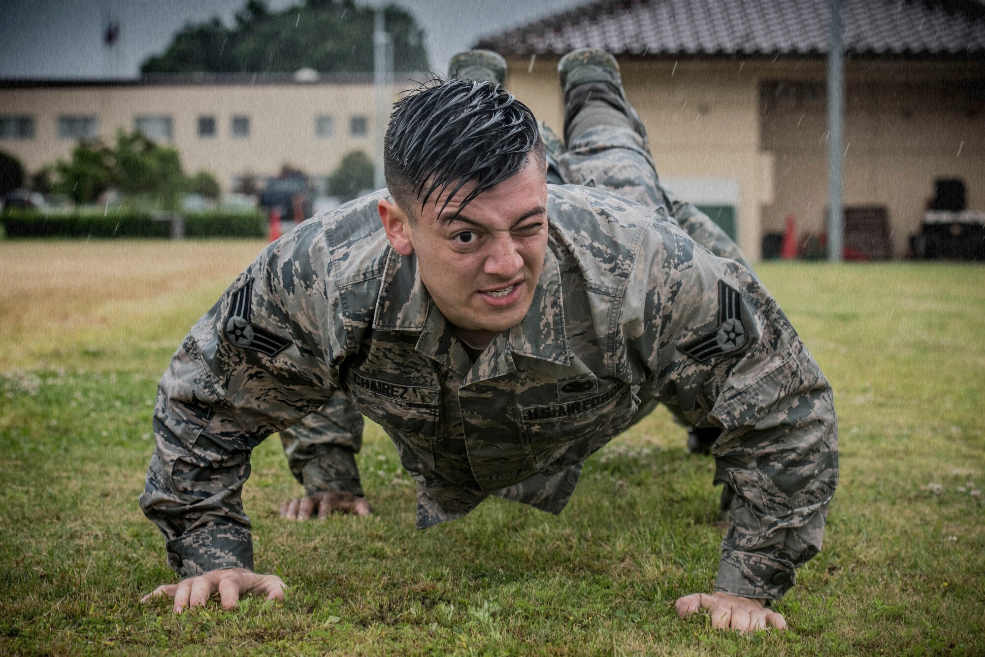 Senior Airman Shain Chairez, 374th Security Forces Squadron response force leader, performs team pushups during Yokota’s 2019 National Police Week Defenders Challenge at Yokota Air Base, Japan, May 21, 2019.